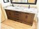 A spacious bathroom featuring a double sink vanity with granite countertops and ample storage at 9109 W Watson Ln, Peoria, AZ 85381