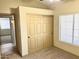 Cozy bedroom featuring a closet, window and soft carpeting at 9109 W Watson Ln, Peoria, AZ 85381