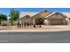 Charming single-story home with desert landscaping, a two-car garage, and a welcoming front entrance at 9109 W Watson Ln, Peoria, AZ 85381
