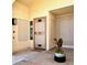 A welcoming front entrance with a decorative security door, outdoor lighting and a flower planter at 9109 W Watson Ln, Peoria, AZ 85381