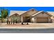 Charming single-story home with desert landscaping, inviting entrance and an attached two car garage at 9109 W Watson Ln, Peoria, AZ 85381