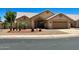 Inviting single-story home featuring desert landscaping, an attached garage and a neutral color palette at 9109 W Watson Ln, Peoria, AZ 85381
