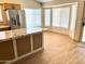 Bright eat-in kitchen area boasts granite counters, stainless steel appliances and lots of natural light through a bay window at 9109 W Watson Ln, Peoria, AZ 85381