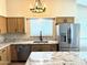 Kitchen with stainless appliances, granite countertops and island at 9109 W Watson Ln, Peoria, AZ 85381