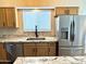 Eat-in kitchen featuring stainless appliances, granite countertops and island at 9109 W Watson Ln, Peoria, AZ 85381
