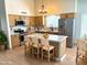 Charming kitchen with stainless steel appliances, granite countertops, and a cozy breakfast bar at 9109 W Watson Ln, Peoria, AZ 85381