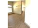 Bright, open living room features light wood flooring, large windows, and neutral paint throughout at 9109 W Watson Ln, Peoria, AZ 85381