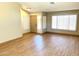 Inviting living room with wood-look flooring, large windows, and lots of natural light at 9109 W Watson Ln, Peoria, AZ 85381
