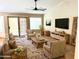 Bright living room with high ceilings, rustic furniture, and a cozy seating arrangement at 9109 W Watson Ln, Peoria, AZ 85381