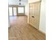 Spacious living room boasts natural light, closet, and wood-look flooring at 9109 W Watson Ln, Peoria, AZ 85381