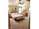 Comfortable bedroom with a plush bed, warm lighting, and elegant rustic wood furnishings at 9109 W Watson Ln, Peoria, AZ 85381