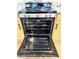 Open oven door with a clean interior and reflective surfaces, showcasing the appliance's condition at 9109 W Watson Ln, Peoria, AZ 85381