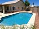 Refreshing in-ground pool with patio, attractive landscaping, and a charming outdoor space for relaxing and entertaining at 9109 W Watson Ln, Peoria, AZ 85381
