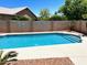 Backyard pool with desert landscaping, offering a private oasis for relaxation and outdoor enjoyment at 9109 W Watson Ln, Peoria, AZ 85381