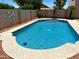 Sparkling pool with a pebble tec deck, surrounded by rock landscaping, perfect for summer relaxation at 9109 W Watson Ln, Peoria, AZ 85381
