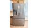 Stainless steel refrigerator with a water and ice dispenser, blending style and functionality at 9109 W Watson Ln, Peoria, AZ 85381