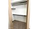 A walk-in closet with shelving and carpeted floor at 9109 W Watson Ln, Peoria, AZ 85381