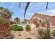 Backyard featuring a private pool and beautiful desert landscaping with a covered patio at 9239 E Karen Dr, Scottsdale, AZ 85260