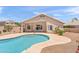 Backyard features a sparkling pool and patio area, perfect for outdoor entertaining at 9239 E Karen Dr, Scottsdale, AZ 85260