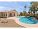 Backyard featuring a private pool with desert landscaping and a covered patio at 9239 E Karen Dr, Scottsdale, AZ 85260