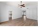 Spacious living room with hardwood floors, ceiling fan, and access to the kitchen at 9239 E Karen Dr, Scottsdale, AZ 85260