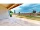 An expansive backyard featuring a stone patio and spacious lawn ideal for outdoor activities at 9814 W Menadota Dr, Peoria, AZ 85382