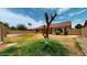 Expansive backyard featuring a lawn, perimeter fencing, and an inviting exterior at 9814 W Menadota Dr, Peoria, AZ 85382