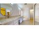 Bathroom with granite countertops, dual sinks, and an abundance of storage at 9814 W Menadota Dr, Peoria, AZ 85382
