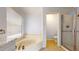 Bathroom with soaker tub, enclosed shower, and designer bronze fixtures at 9814 W Menadota Dr, Peoria, AZ 85382