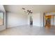 Bedroom with ceiling fan and archway to adjoining bath and dressing area at 9814 W Menadota Dr, Peoria, AZ 85382