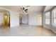 Bedroom with ceiling fan, closet, and access to outdoor patio space at 9814 W Menadota Dr, Peoria, AZ 85382