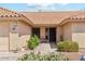 Inviting front entrance with a tile roof, desert landscaping, and walkway to the front door at 9814 W Menadota Dr, Peoria, AZ 85382