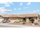 Charming single-story home with desert landscaping, a tile roof and attached two-car garage at 9814 W Menadota Dr, Peoria, AZ 85382