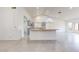 Spacious kitchen boasts an island, stainless appliances, and ample countertop space at 9814 W Menadota Dr, Peoria, AZ 85382