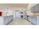 Spacious kitchen features matching appliances, granite countertops, and tile flooring at 9814 W Menadota Dr, Peoria, AZ 85382