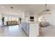 Open kitchen and dining area with granite countertops and seamless living space at 9814 W Menadota Dr, Peoria, AZ 85382