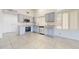 Modern kitchen equipped with stainless steel appliances and light colored wood cabinets at 9814 W Menadota Dr, Peoria, AZ 85382