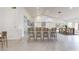 Stylish kitchen features a breakfast bar and flows seamlessly into the dining area at 9814 W Menadota Dr, Peoria, AZ 85382