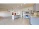 Bright kitchen with a kitchen island, stainless appliances, and ample counter space at 9814 W Menadota Dr, Peoria, AZ 85382