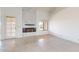 Cozy living room featuring a marble fireplace and natural light from the window at 9814 W Menadota Dr, Peoria, AZ 85382