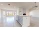 Bright, open living space with a modern fireplace and granite countertops on a serving bar at 9814 W Menadota Dr, Peoria, AZ 85382