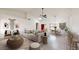 Bright living room with a vaulted ceiling, modern decor, and an open concept layout for easy living at 9814 W Menadota Dr, Peoria, AZ 85382