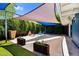 Charming backyard offers a cozy lounge area and beautifully landscaped surroundings at 1029 E Palo Verde Dr, Phoenix, AZ 85014