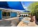 Backyard with modern outdoor furniture and shade sails for comfortable outdoor living at 1029 E Palo Verde Dr, Phoenix, AZ 85014