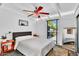 Cozy bedroom with a large window, ceiling fan, and stylish decor at 1029 E Palo Verde Dr, Phoenix, AZ 85014