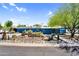Charming blue home featuring desert landscaping, complemented by an abundance of cacti and native vegetation at 1029 E Palo Verde Dr, Phoenix, AZ 85014