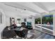 Cozy living room with open access to the outdoor pool area, featuring lots of natural light and modern decor at 1029 E Palo Verde Dr, Phoenix, AZ 85014