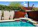 Tranquil backyard retreat featuring a soothing water feature and vibrant greenery at 1029 E Palo Verde Dr, Phoenix, AZ 85014
