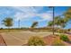 Enjoy a sunny afternoon at this outdoor basketball court with a manicured landscape and bright blue skies at 1101 W Oleander Ave, Queen Creek, AZ 85140