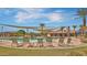 Community pool area with shaded seating, comfortable lounge chairs, and resort-style amenities at 1101 W Oleander Ave, Queen Creek, AZ 85140